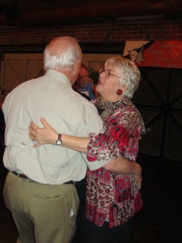 juliebaldwinandhusbandbillmasontakeaswingaroundthedancefloor.jpg